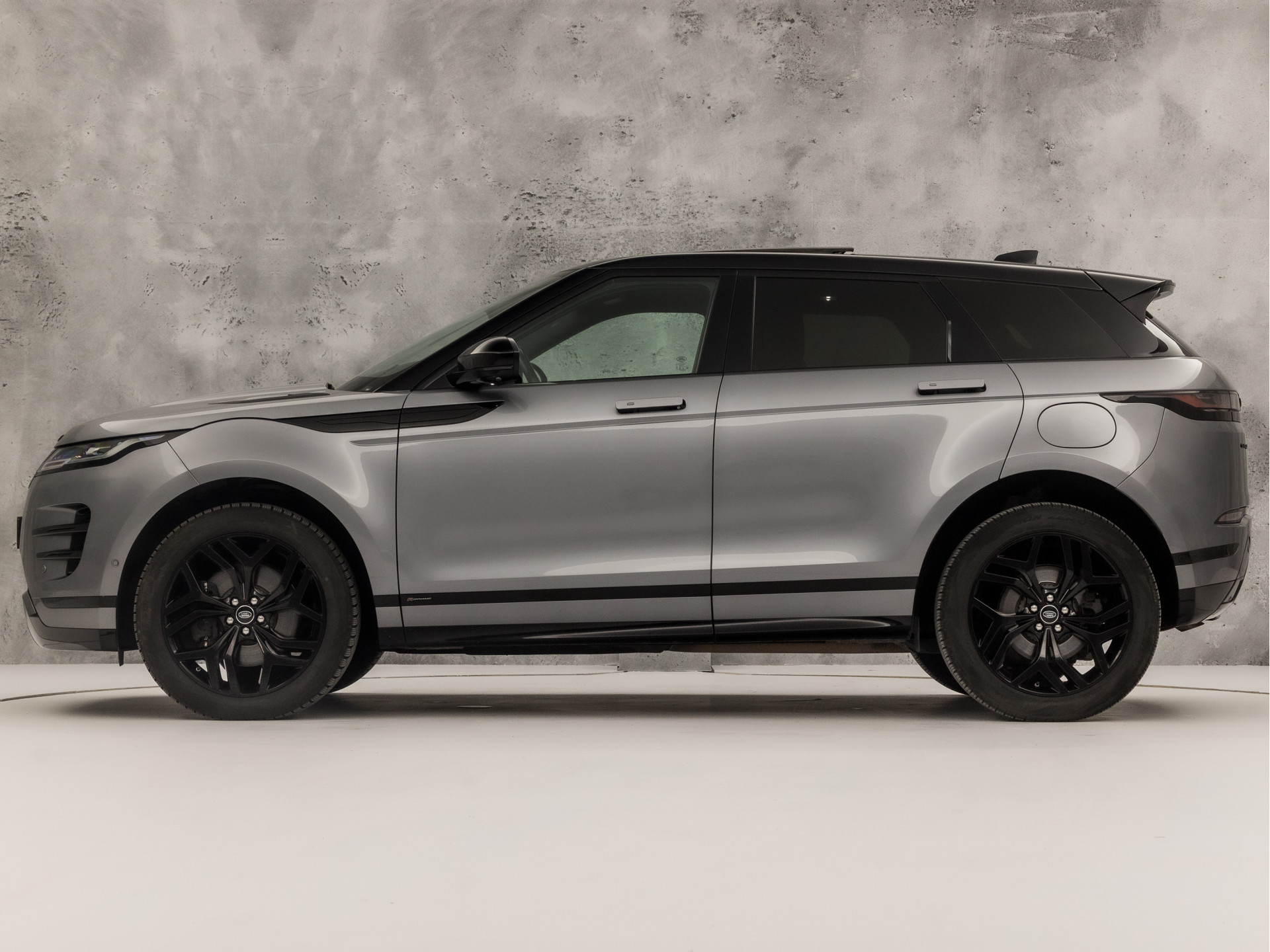 Land Rover Range Rover Evoque 1.5 P300e AWD R-Dynamic SE 309Pk Automaat (PANORAMADAK, APPLE CARPLAY, 360 CAMERA, MERIDIAN AUDIO, MEMORY SEATS, STUUR/STOELVERWARMING, ADAPTIVE CRUISE, VIRTUAL DASHBOARD, NIEUWSTAAT)
