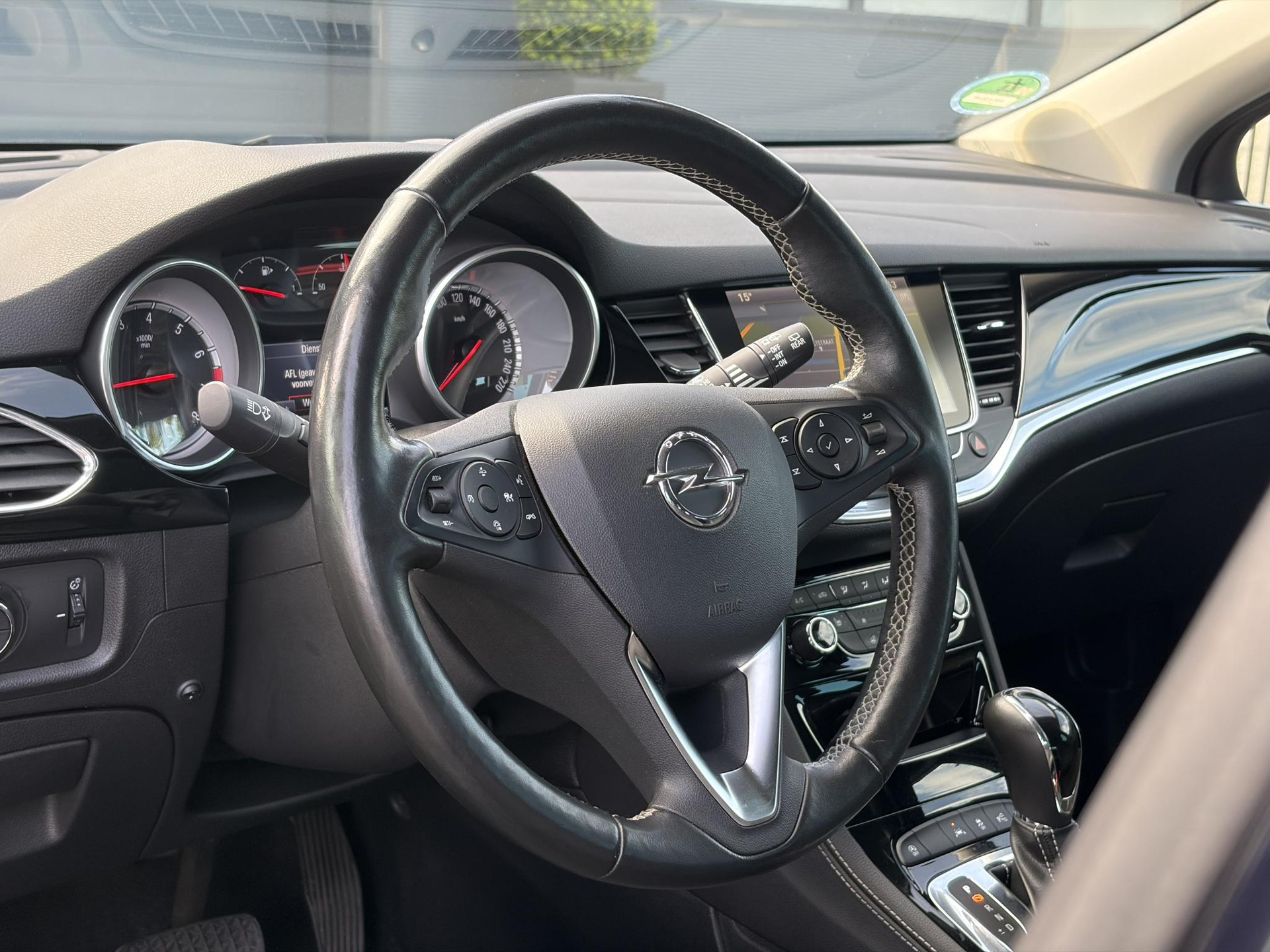 Opel Astra Sports Tourer 1.4 Business Executive ✓2 Eigenaar✓Camera✓Navi✓Trekhaakt✓Carplay✓Stoelverw✓Stuurverw✓Automaat✓Dealer Onderhouden✓Keyless✓Clima✓Cruise✓Pdc V+A✓Halfleder✓Comfortstoelen✓150pk✓Rijstrooksensor✓Dodehoeksensor✓Elekt Stoelen✓Lm velgen✓N.