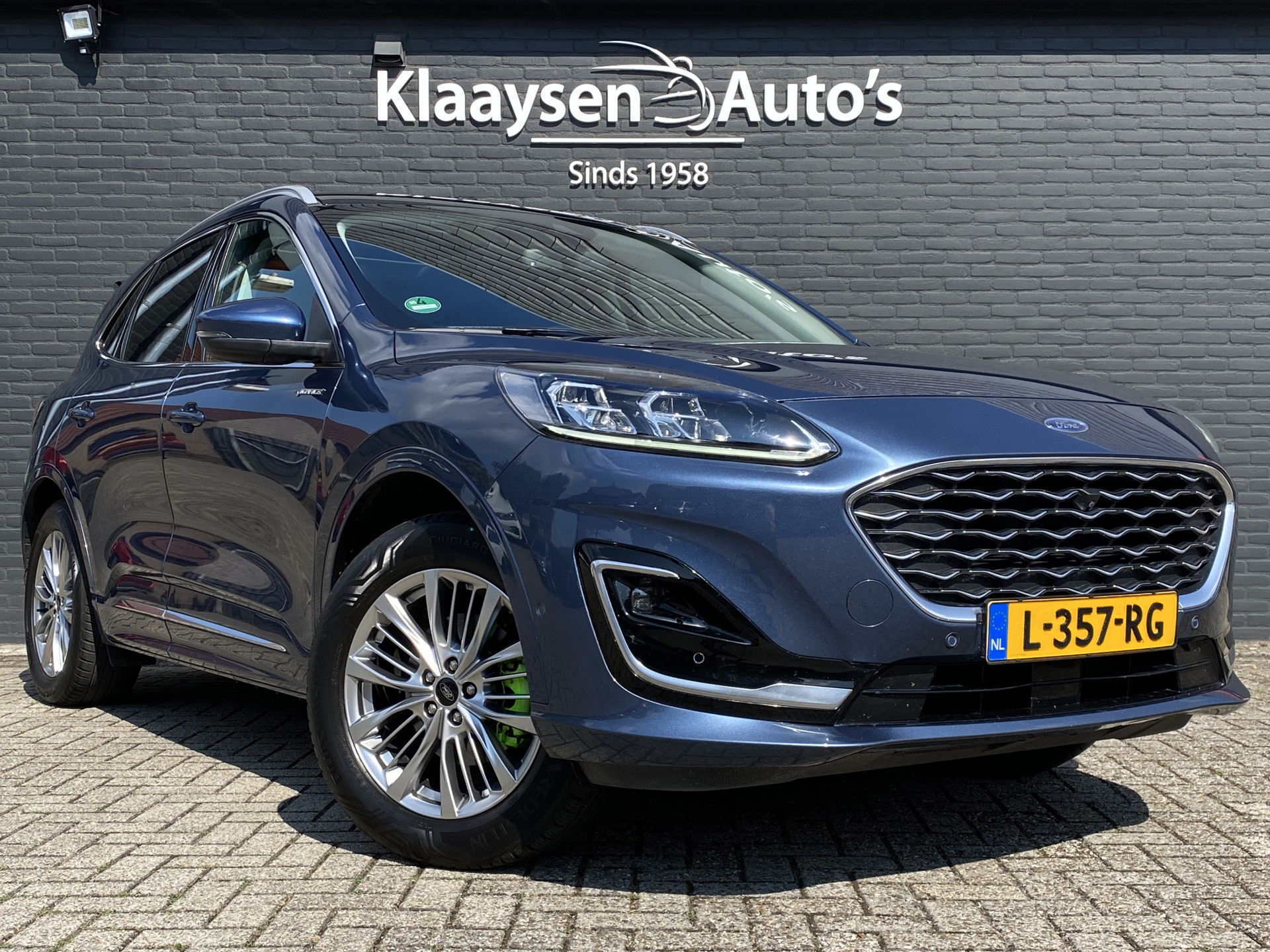 Ford Kuga 2.5 PHEV Vignale 225 pk | dealer onderh. | panoramadak | leder interieur | elektr. v. stoelen | navigatie | B&O audio