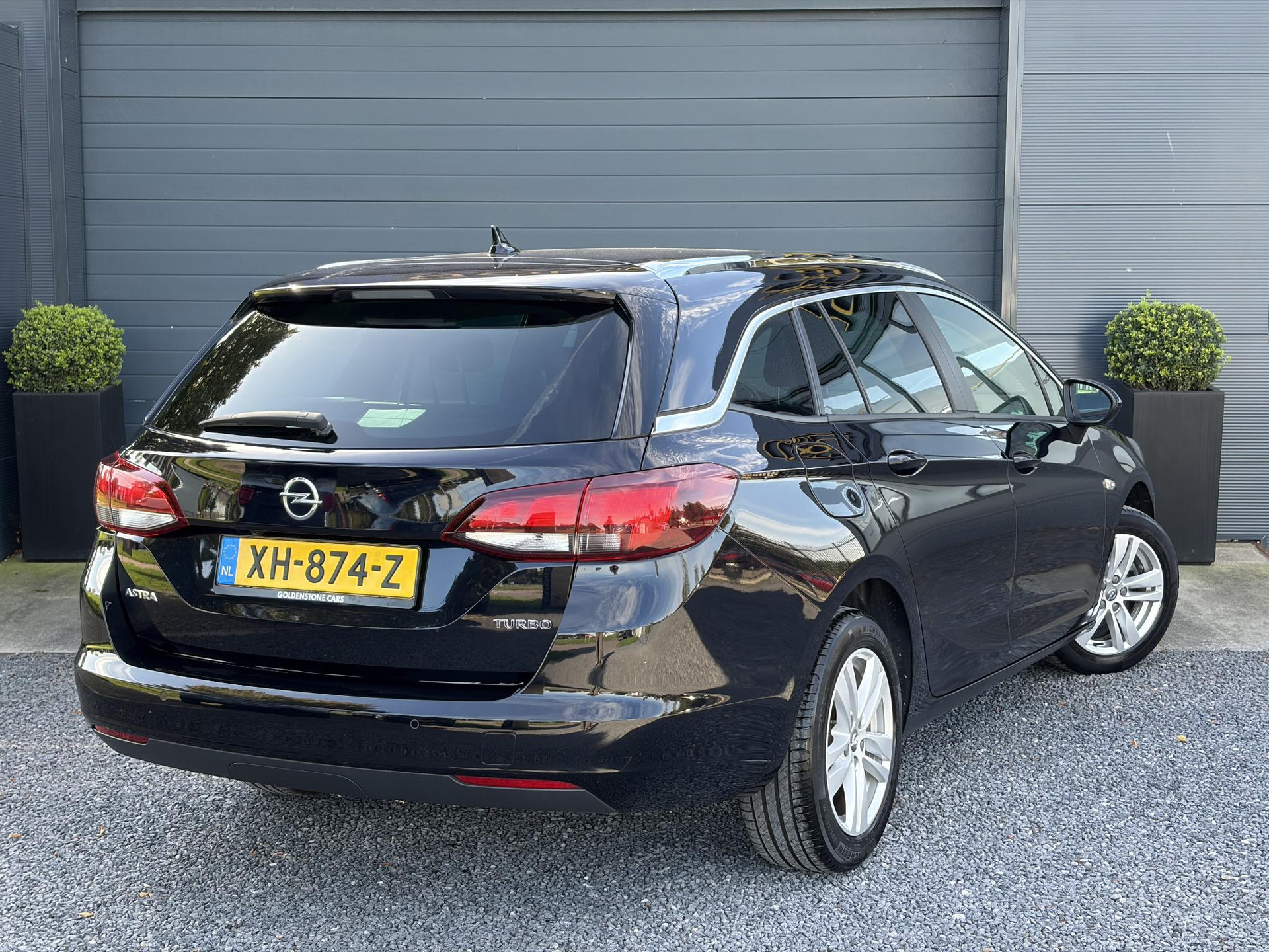 Opel Astra Sports Tourer 1.4 Turbo Online Edition ✓150pk✓2e Eigenaar✓Camera✓Carplay✓Navi✓Pdc V+A✓Stoelverw✓Stuurverw✓Clima✓Cruise✓Lm velgen✓6 Bak✓Comfortstoelen✓Dealer Onderhouden✓N.A.P✓Bj 12-2018✓Apk tot 01-2027
