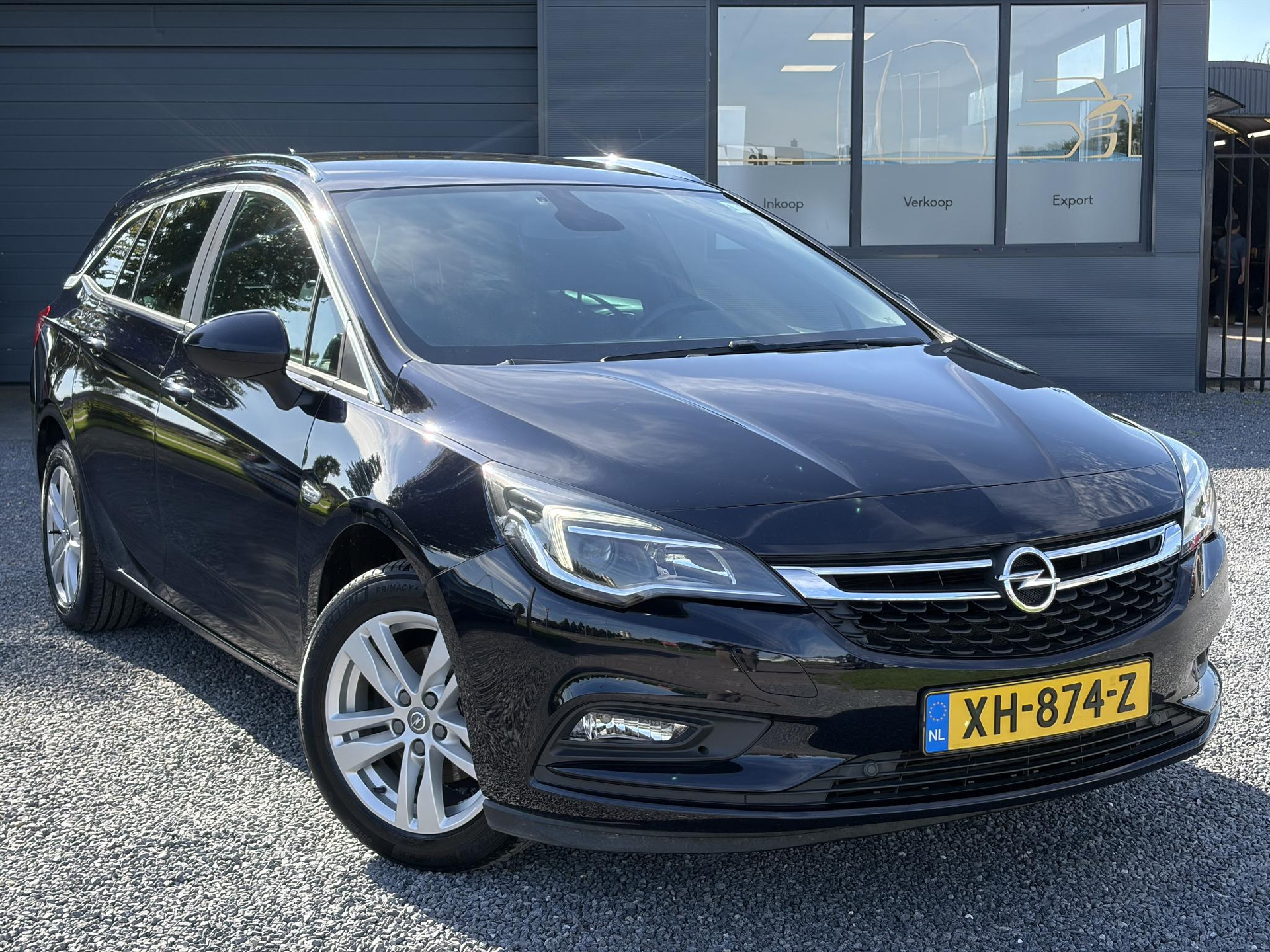 Opel Astra Sports Tourer 1.4 Turbo Online Edition ✓150pk✓2e Eigenaar✓Camera✓Carplay✓Navi✓Pdc V+A✓Stoelverw✓Stuurverw✓Clima✓Cruise✓Lm velgen✓6 Bak✓Comfortstoelen✓Dealer Onderhouden✓N.A.P✓Bj 12-2018✓Apk tot 01-2027
