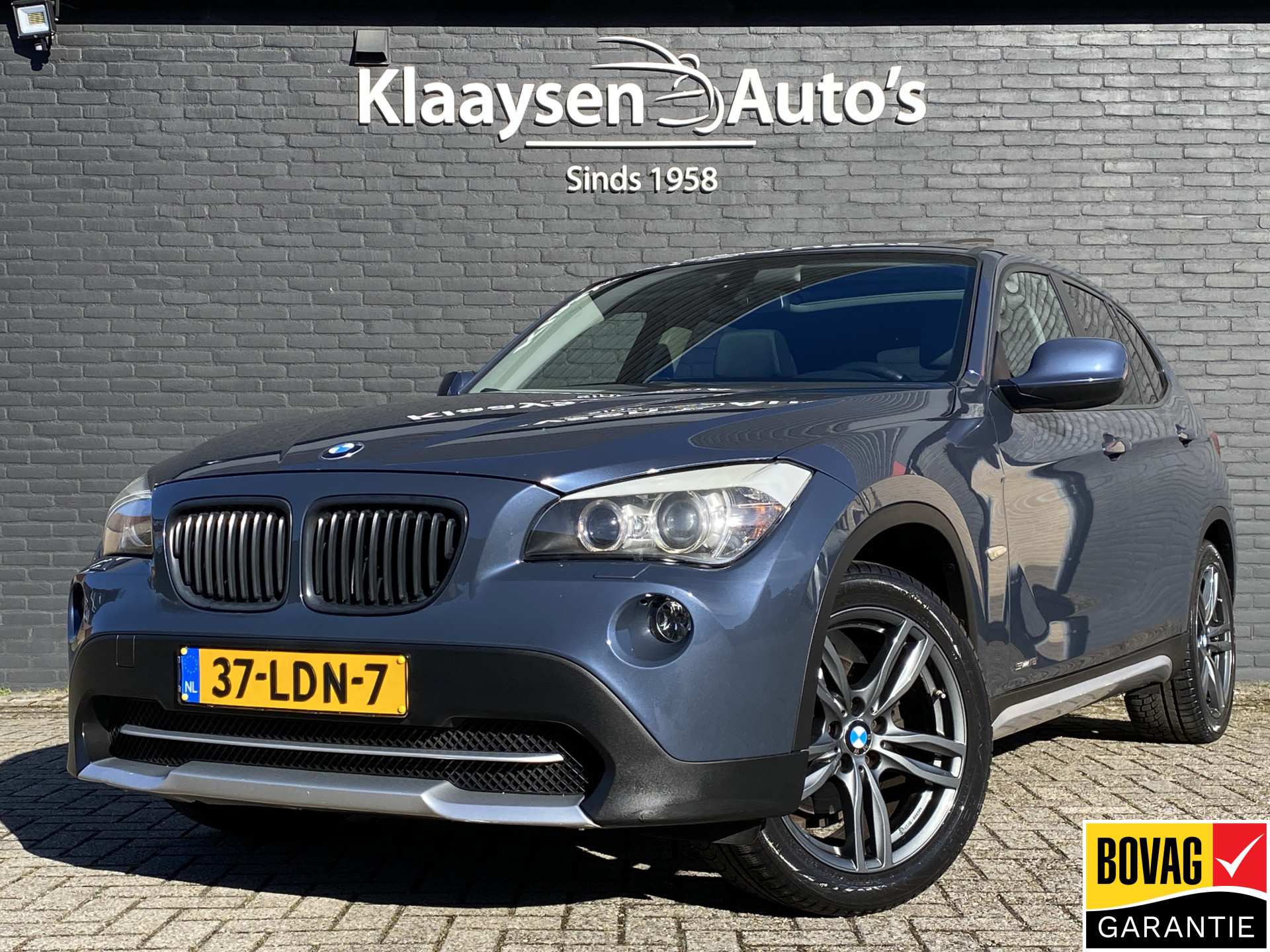 BMW X1 sDrive18i Executive AUT. | navigatie | panoramadak | sportstoelen | xenon verlichting | lichtmetalen velgen 18 inch