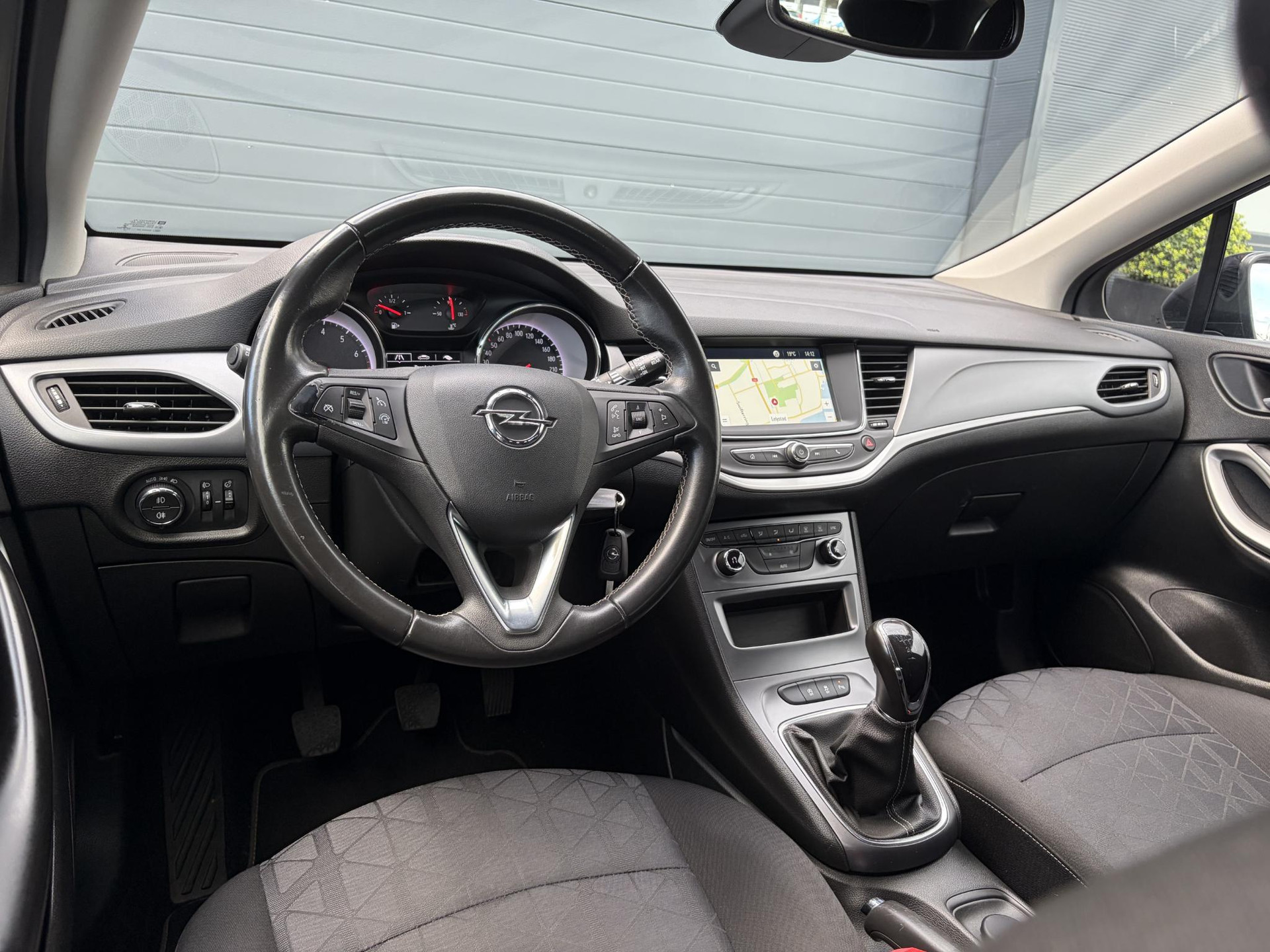 Opel Astra Sports Tourer 1.4 Turbo 120 Jaar Edition ✓150pk✓Carplay✓Navi✓Trekhaak✓Pdc V+A✓Clima✓Cruise✓6 Bak✓Lm velgen✓N.A.P✓Apk tot 02-2028