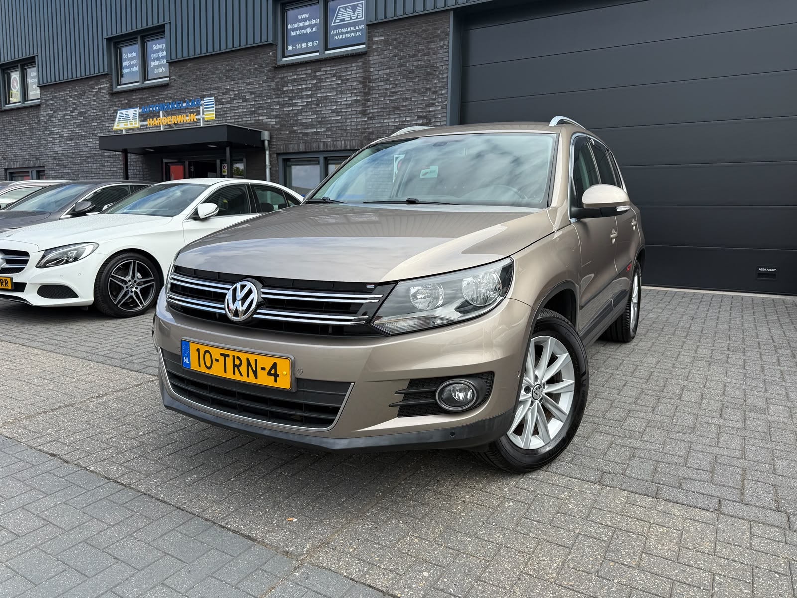 Volkswagen Tiguan 1.4 TSI Sport&Style | 1E EIGENAAR | 3/6/12MND GARANTIE | NAVI | PDC | 160 PK | LAGE KM |
