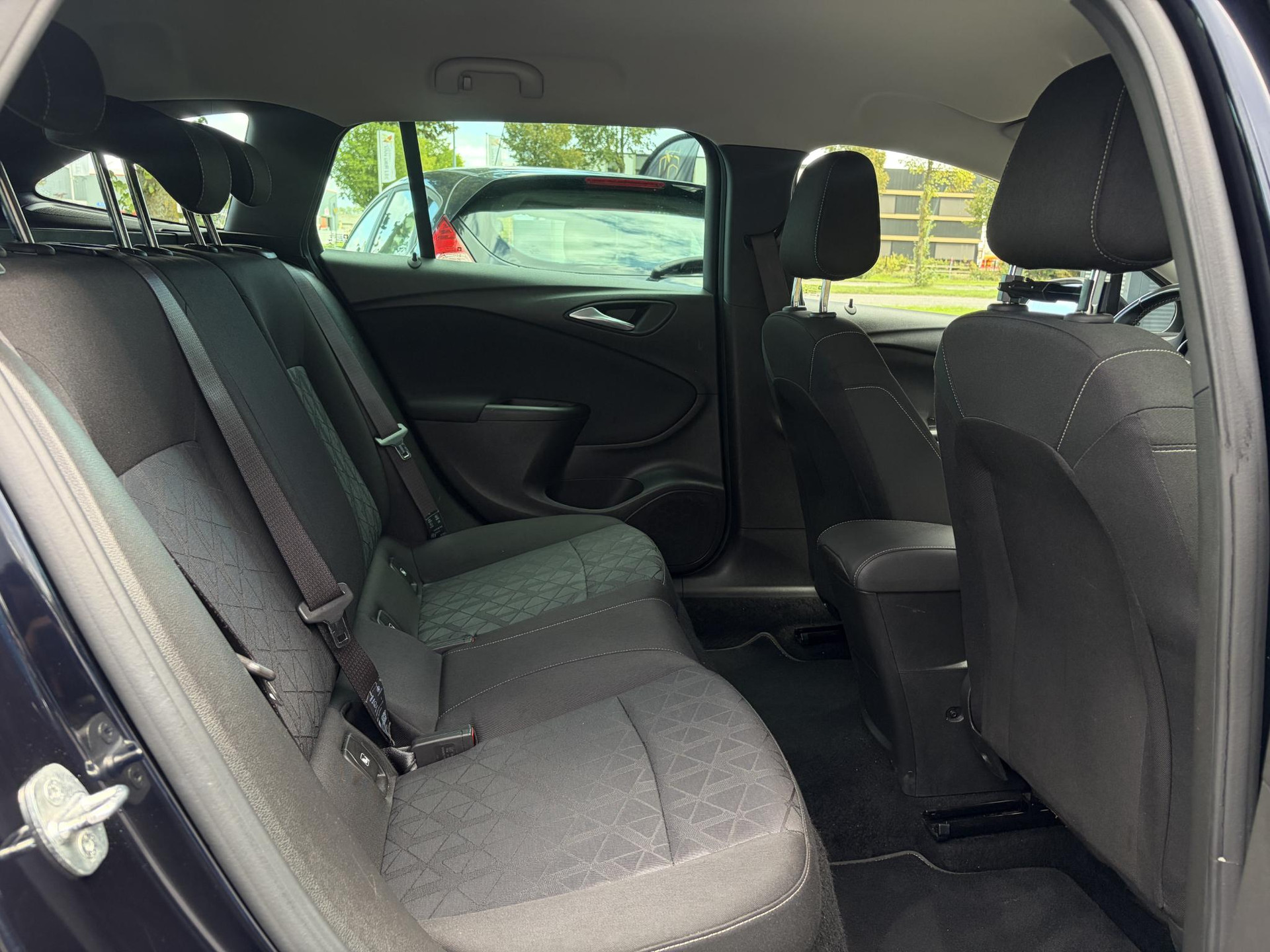 Opel Astra Sports Tourer 1.4 Turbo 120 Jaar Edition ✓150pk✓Carplay✓Navi✓Trekhaak✓Pdc V+A✓Clima✓Cruise✓6 Bak✓Lm velgen✓N.A.P✓Apk tot 02-2028