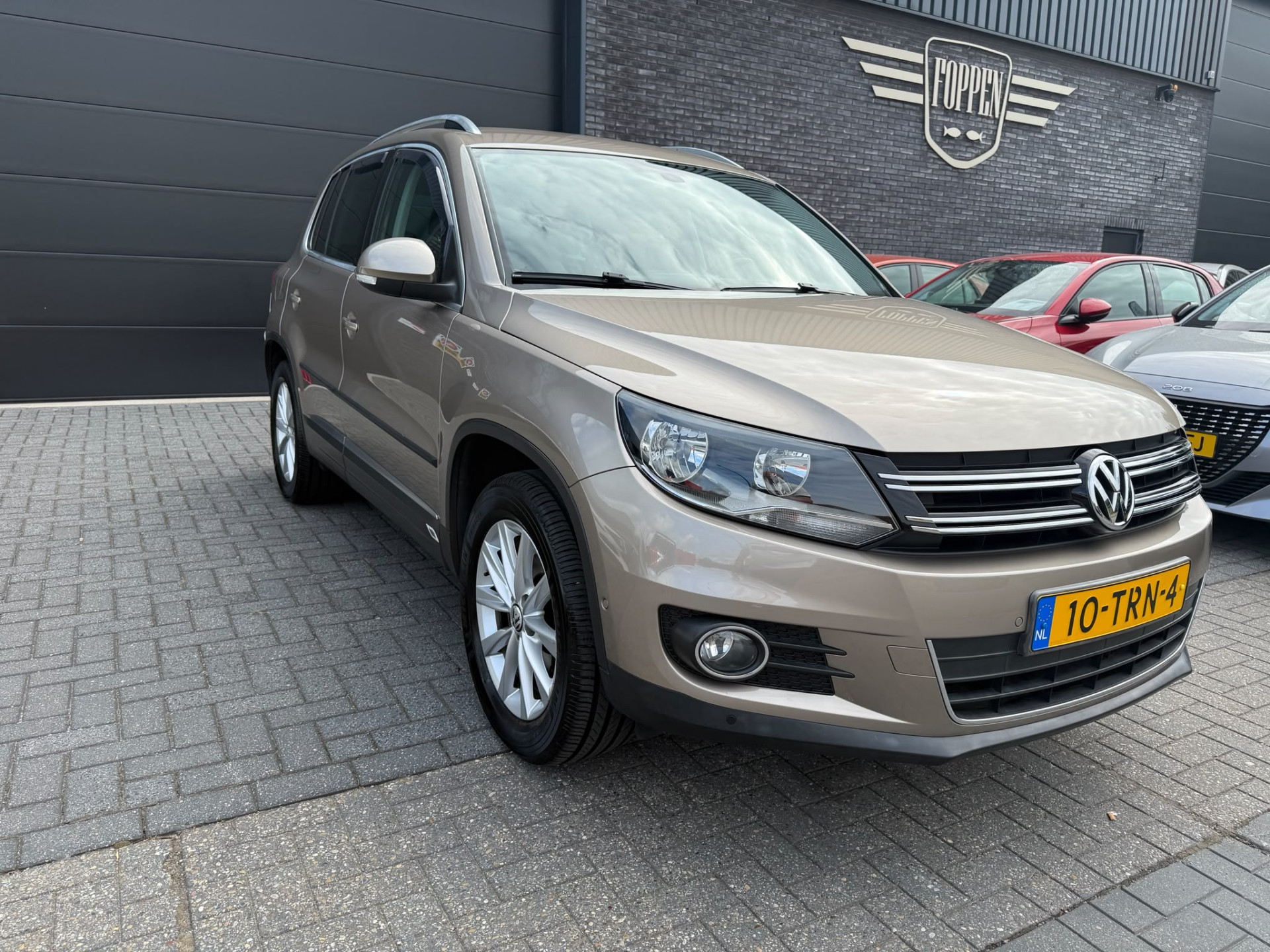 Volkswagen Tiguan 1.4 TSI Sport&Style | 1E EIGENAAR | 3/6/12MND GARANTIE | NAVI | PDC | 160 PK | LAGE KM |
