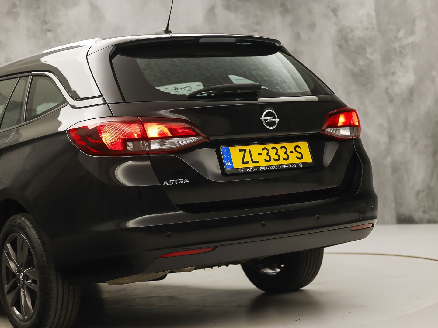 Opel Astra Sports Tourer 1.0 Turbo 120 Jaar Edition (APPLE CARPLAY, NAVIGATIE, LM VELGEN, PARKEERSENSOREN, SPORTSTOELEN, CRUISE, NIEUWE APK, NIEUWSTAAT)